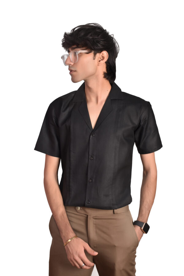 A model wearing black cuban collar shirt